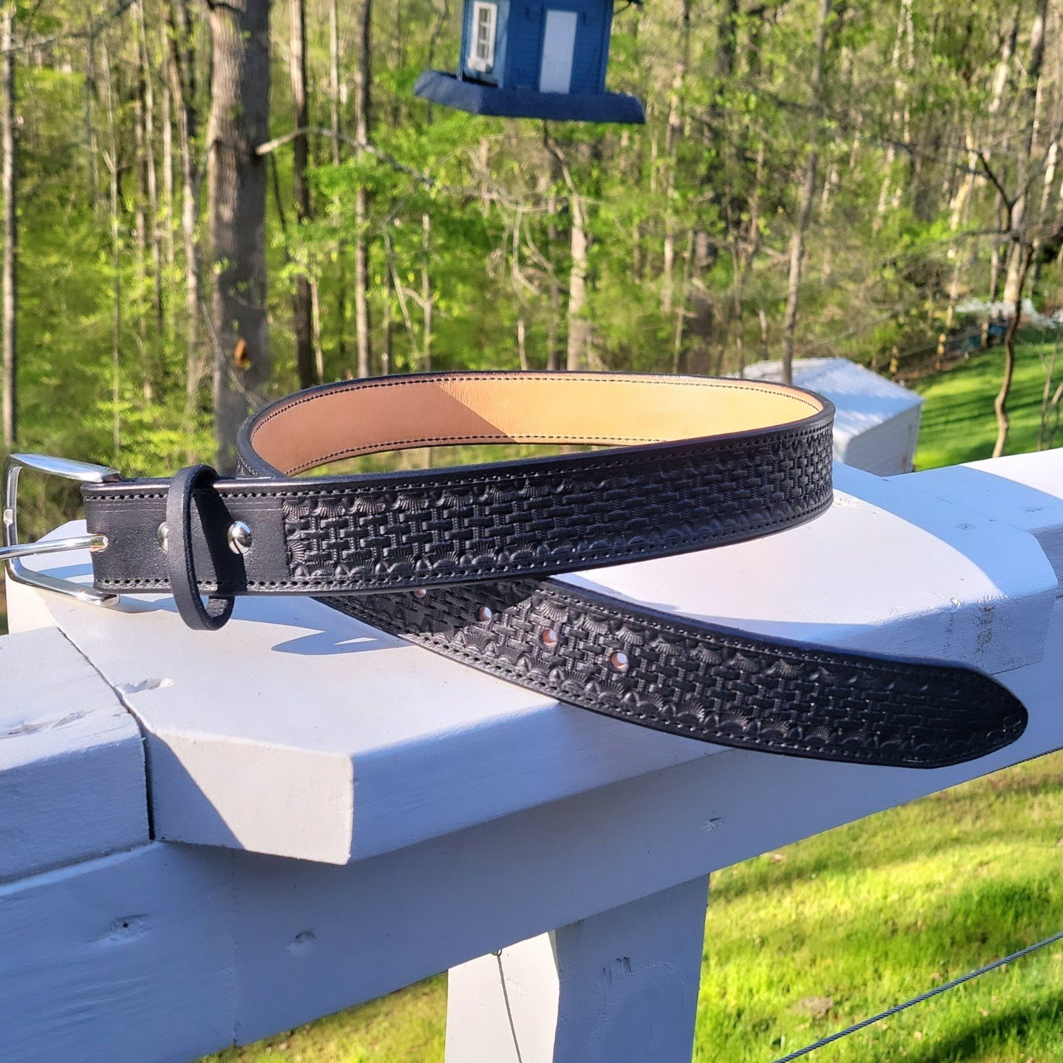 Hand-tooled black leather belt